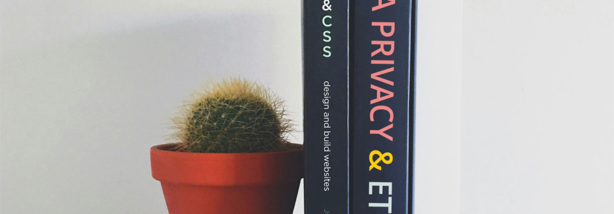 An image of a thick book with the words “Data Privacy and Ethics” on the cover.